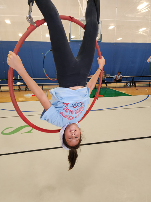 Girl doing upside-down stunt